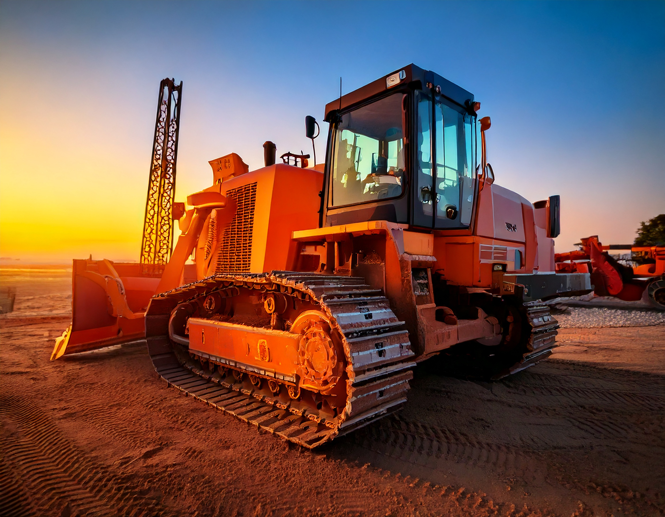 稼働中の建設機器に取り付けられた放熱フィンが、エンジンや配管の熱を効率的に逃がし、機器の安定稼働を支えている。